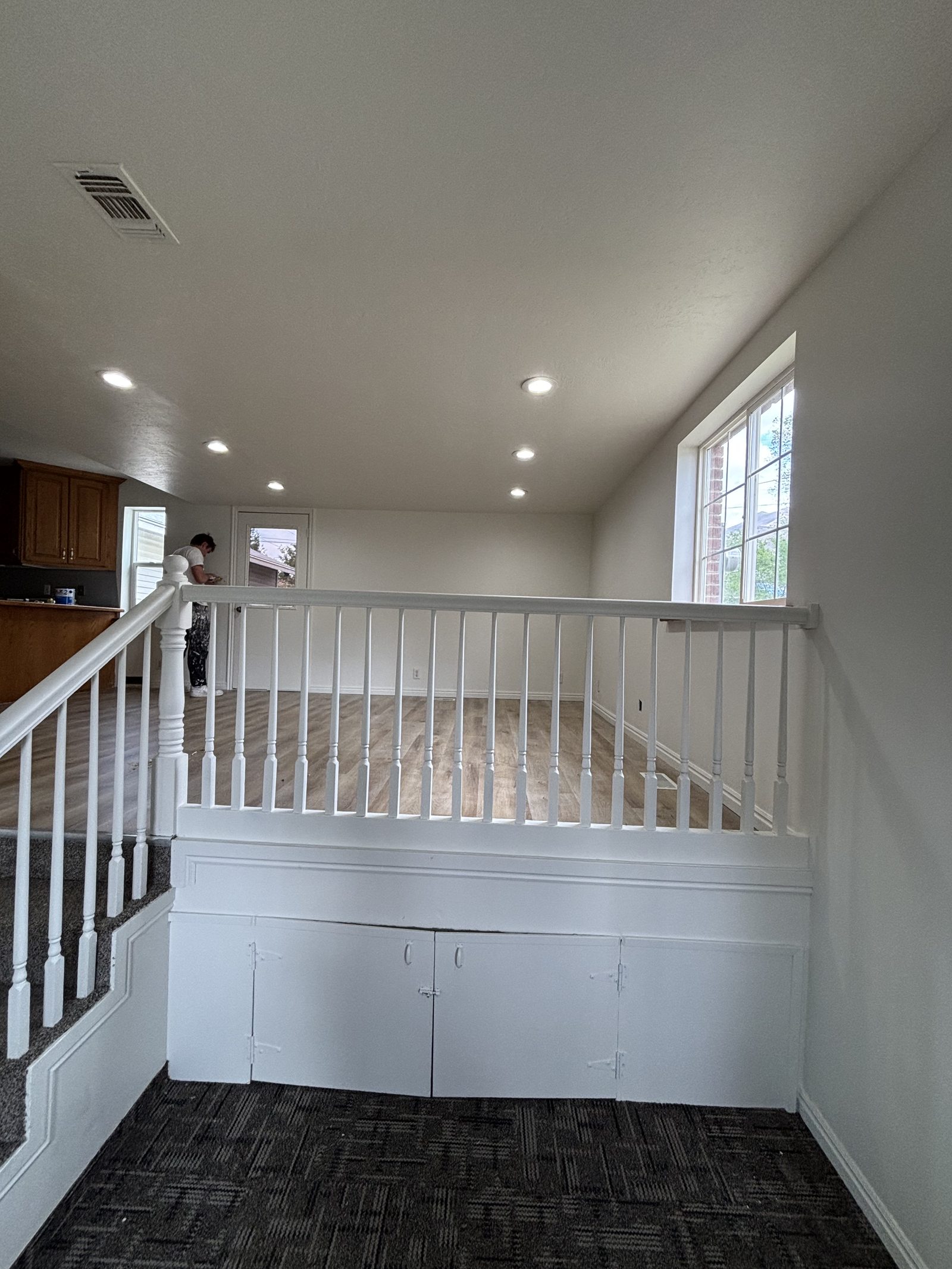 Freshly painted railing and trim by Handy Pro Utah