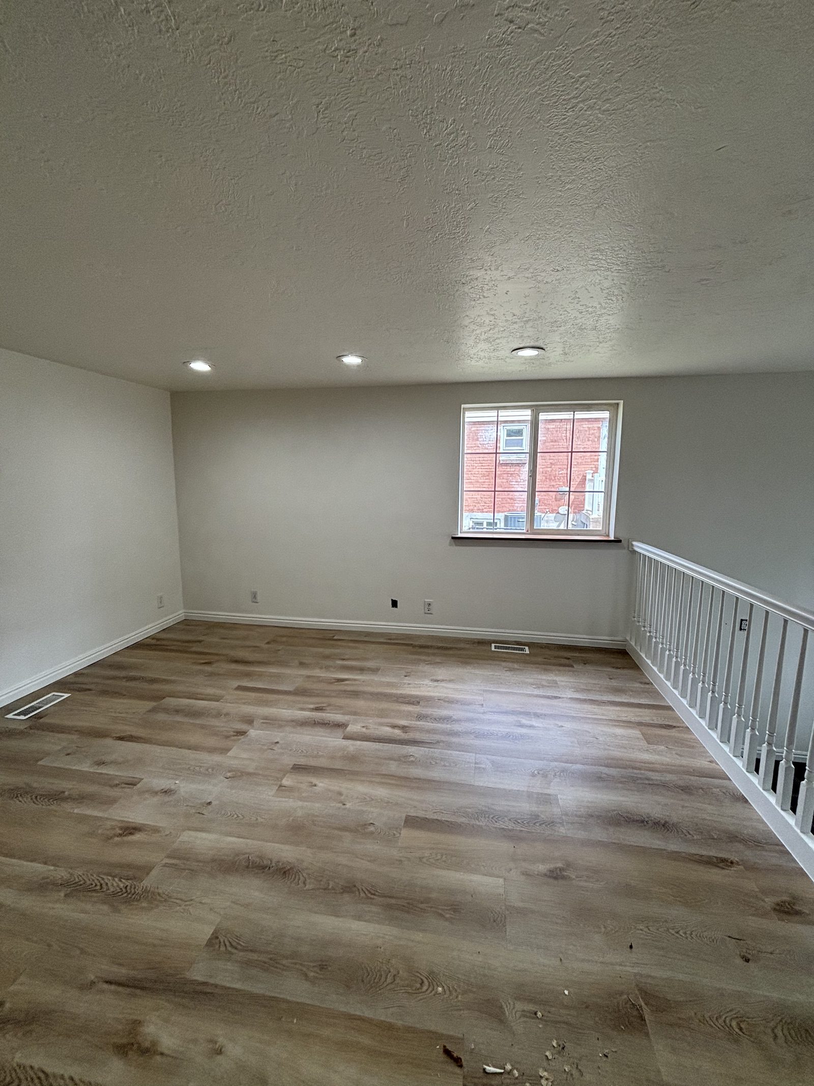 Room refresh with new flooring and finish work by Handy Pro Utah
